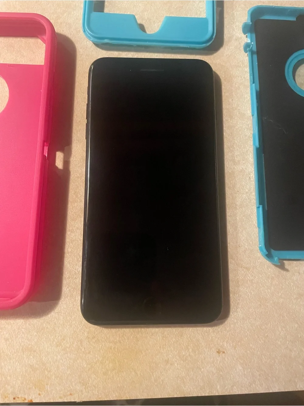 Apple IPhone 7 Plus with Pink and Teal Protective Phone Case with Front Frame.
